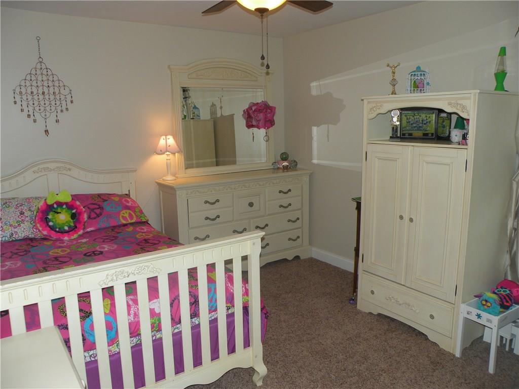 1145 Mohawk Road McDonald, PA 15057 - Photo 19 of 24 1145 Mohawk Road Bedroom 2- Neutral wall tone, neutral carpeting, ceiling fan with light