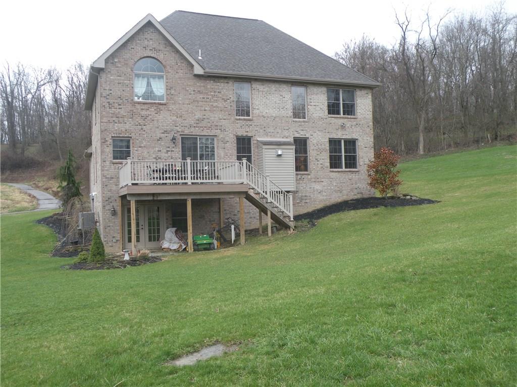 1145 Mohawk Road McDonald, PA 15057 - Photo 23 of 24 1145 Mohawk Road Rear - Spacious 2 car attached garage, level concrete driveway & walk, large rear deck overlooking the great yard!