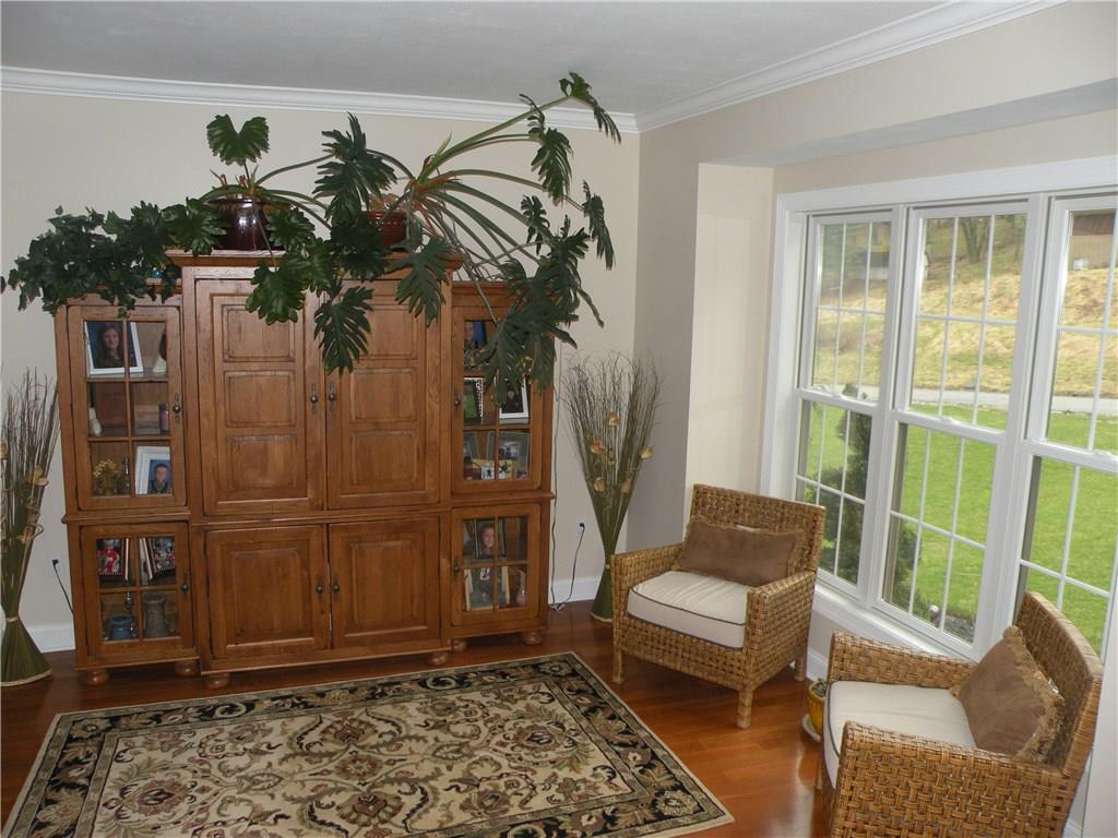 1145 Mohawk Road McDonald, PA 15057 - Photo 4 of 24 1145 Mohawk Rd. Living Room - Neutral wall tone, polished hardwood flooring, large windows