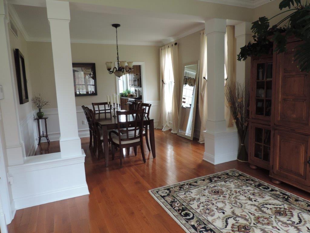 1145 Mohawk Road McDonald, PA 15057 - Photo 5 of 24 1145 Mohawk Rd. Dining Room - Neutral wall tone, neutral chair railing, polished hardwood flooring, custom chandelier