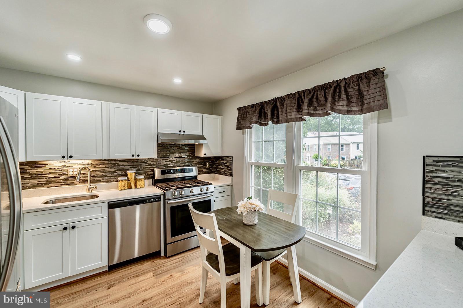 2410 Alsop Court Reston, VA 20191 - Photo 2 of 23 Renovated Kitchen w/ white cabinets & countertop