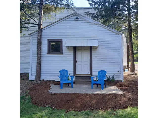 a backyard of a house with lots of green space