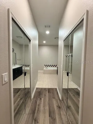 a bathroom with a sink and glass door
