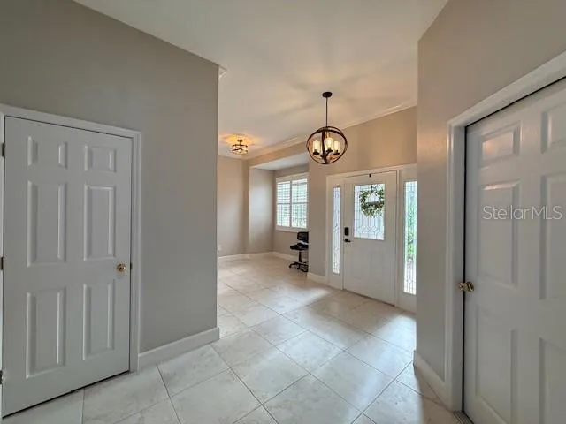 a view of a hallway with wooden shelves