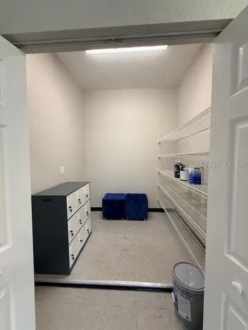 a kitchen with a wooden floor and toilet