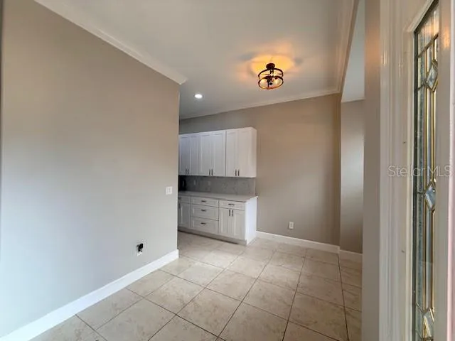 a kitchen with granite countertop a stove and a sink