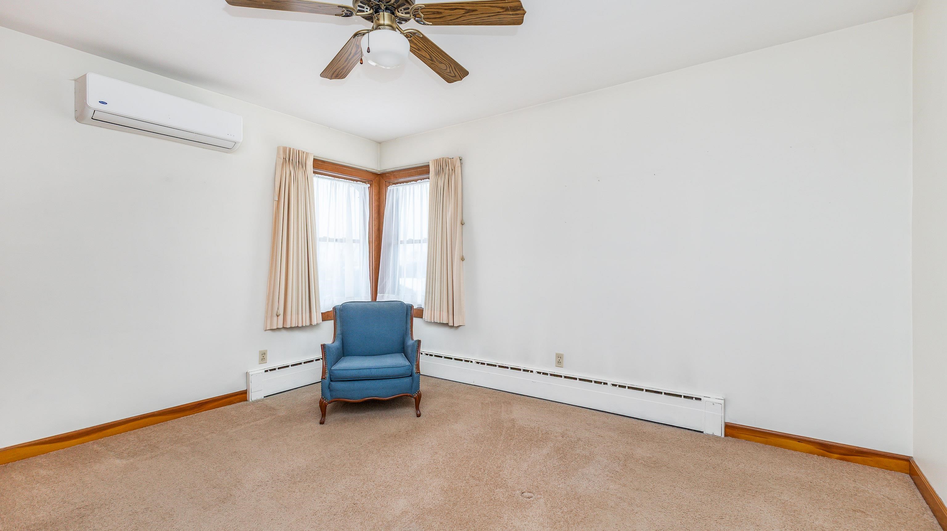 319 East Catlin Street Elizabeth, IL 61028 - Photo 12 of 26 a room with window and a ceiling fan