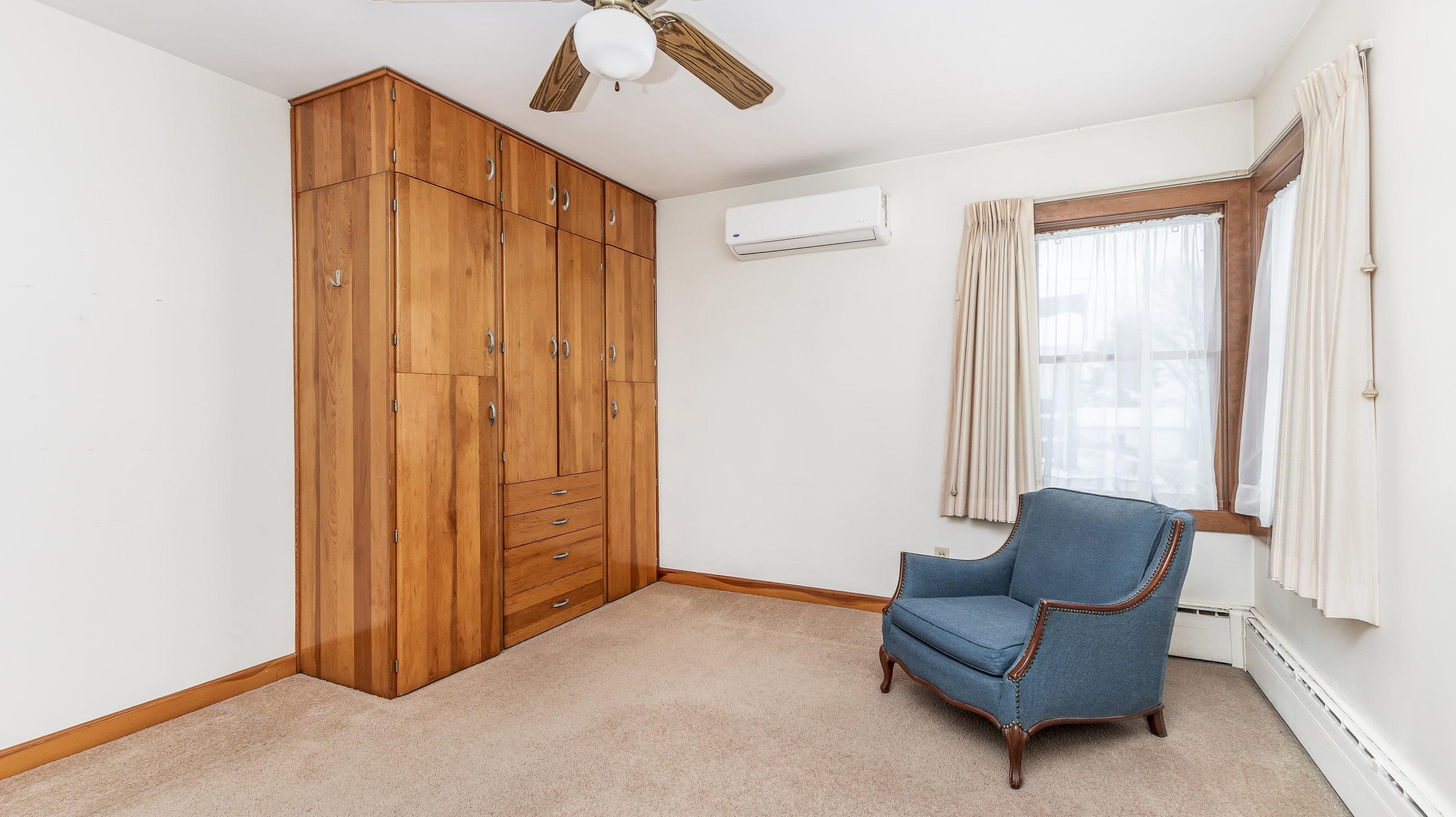 319 East Catlin Street Elizabeth, IL 61028 - Photo 13 of 26 a living room with furniture and a window