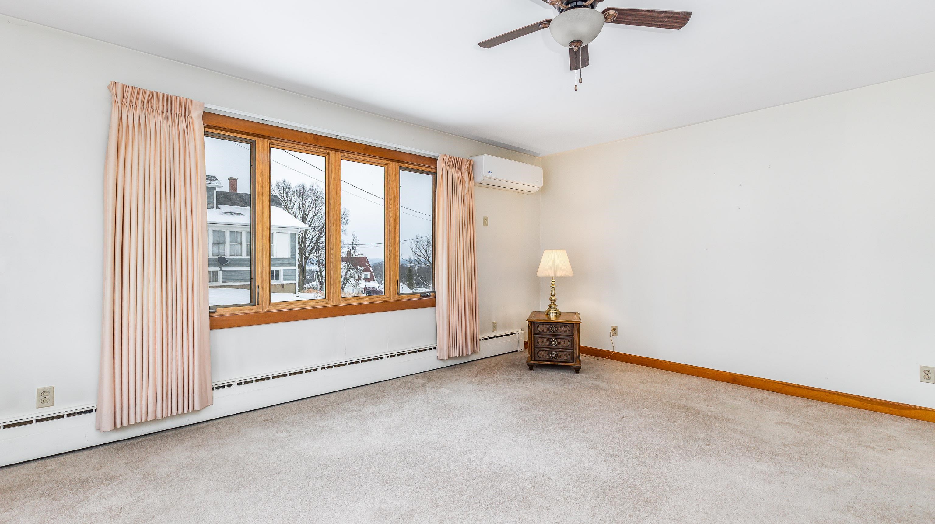 319 East Catlin Street Elizabeth, IL 61028 - Photo 4 of 26 a view of an empty room with a window
