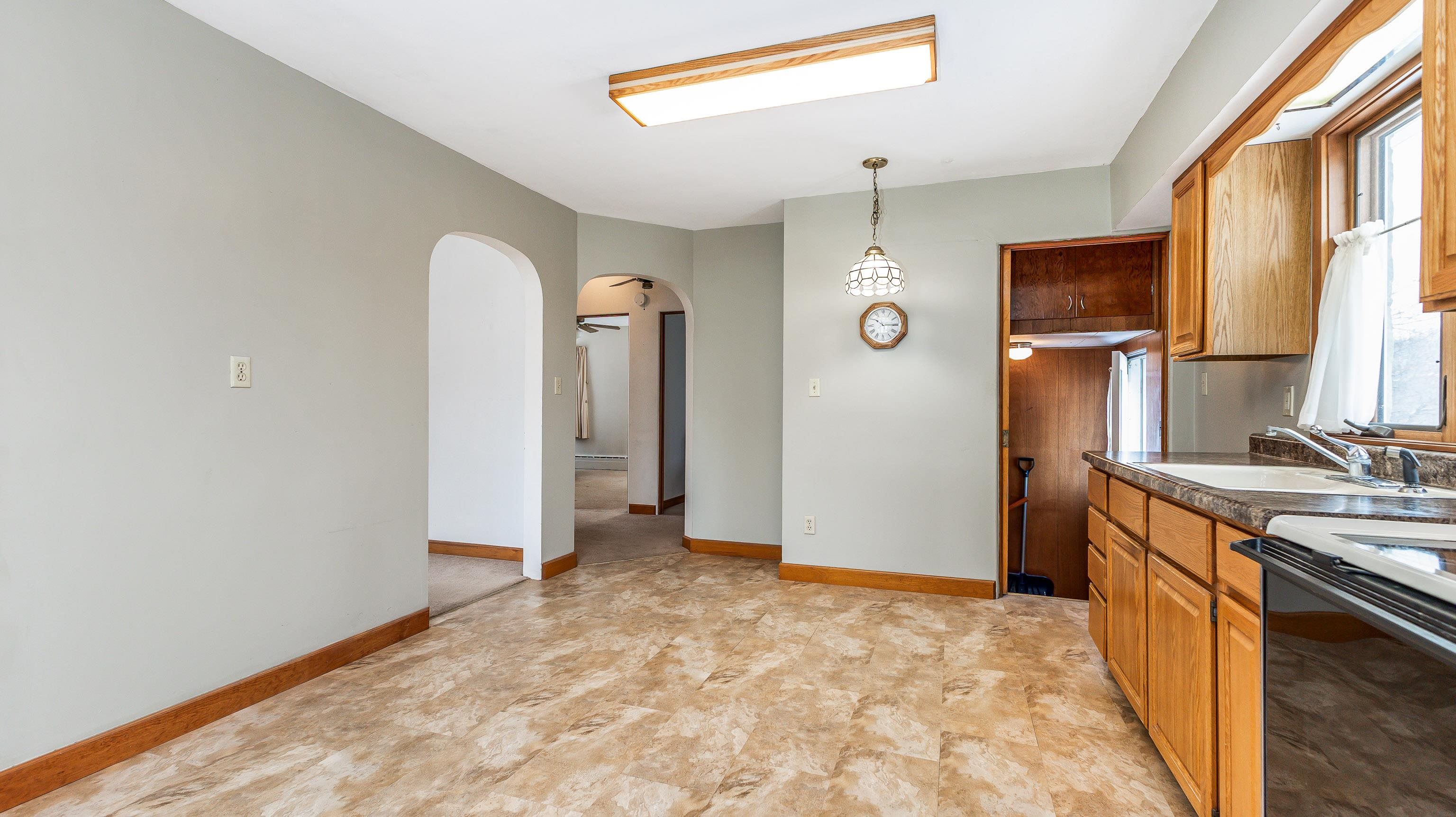 319 East Catlin Street Elizabeth, IL 61028 - Photo 9 of 26 a view of a kitchen cabinets and wooden floor