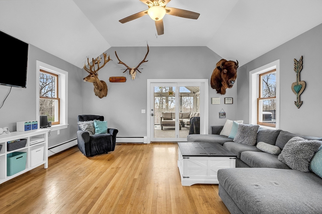 79 Tyler Road Townsend, MA 01469 - Photo 14 of 41 a living room with furniture a flat screen tv and a window