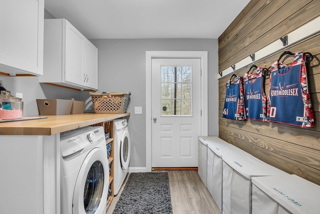 79 Tyler Road Townsend, MA 01469 - Photo 18 of 41 a view of a storage and utility room with washer and dryer