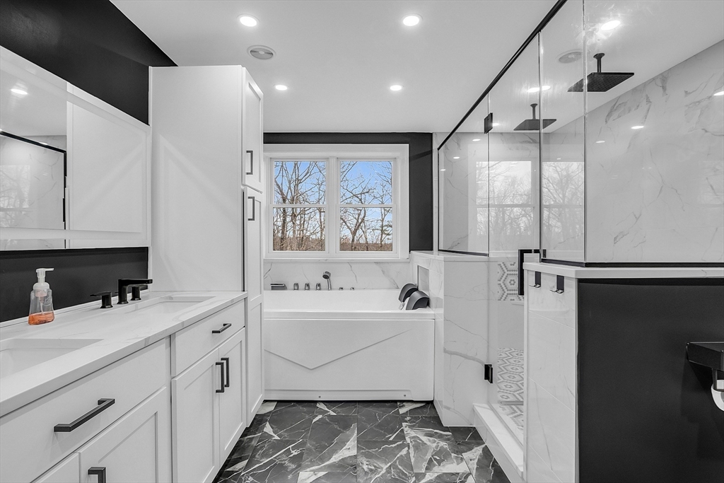 79 Tyler Road Townsend, MA 01469 - Photo 23 of 41 a bathroom with a double vanity sink mirror and bathtub