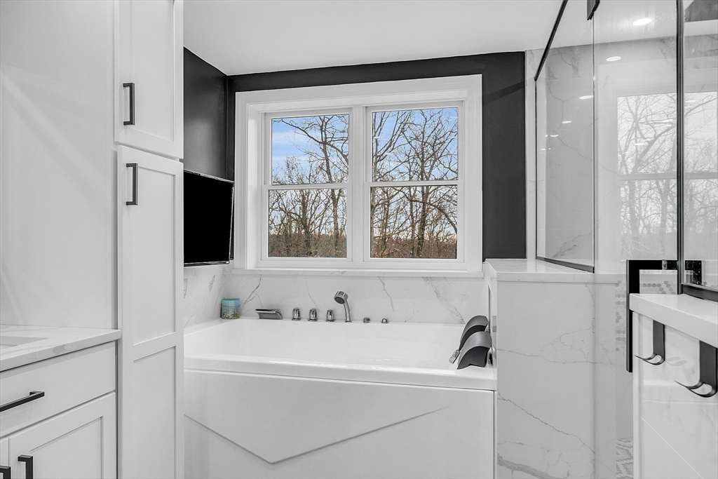 79 Tyler Road Townsend, MA 01469 - Photo 24 of 41 a bathroom with a bathtub and a window