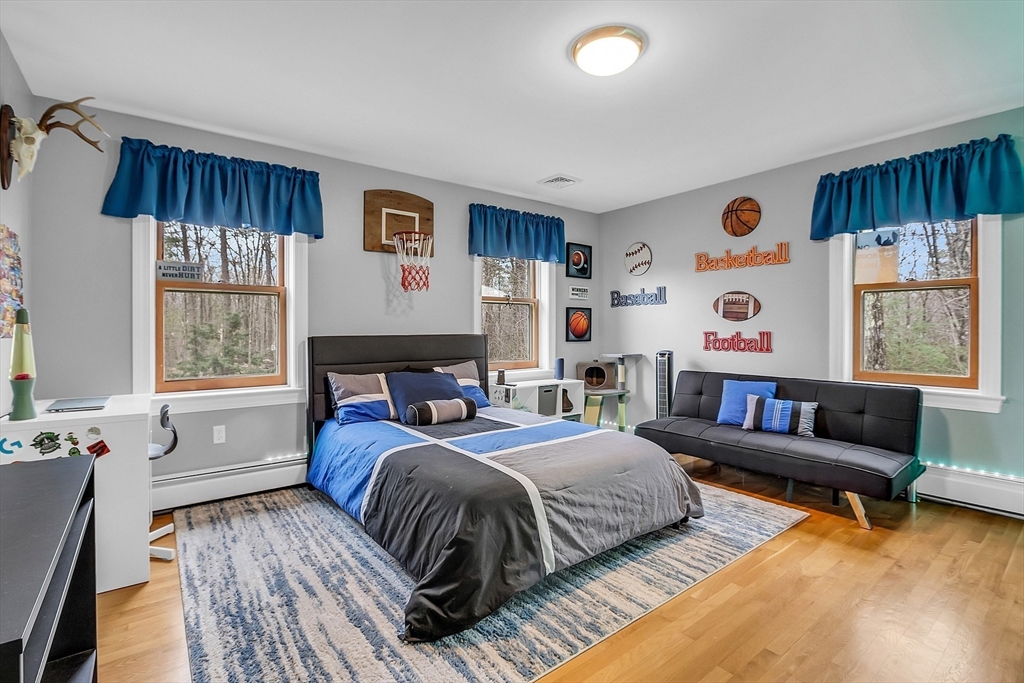 79 Tyler Road Townsend, MA 01469 - Photo 28 of 41 a bedroom with a bed couch and window