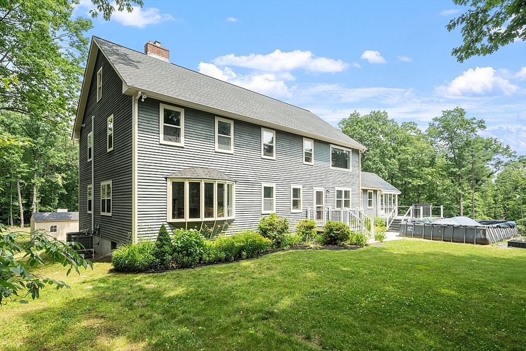 79 Tyler Road Townsend, MA 01469 - Photo 37 of 41 a front view of a house with a yard