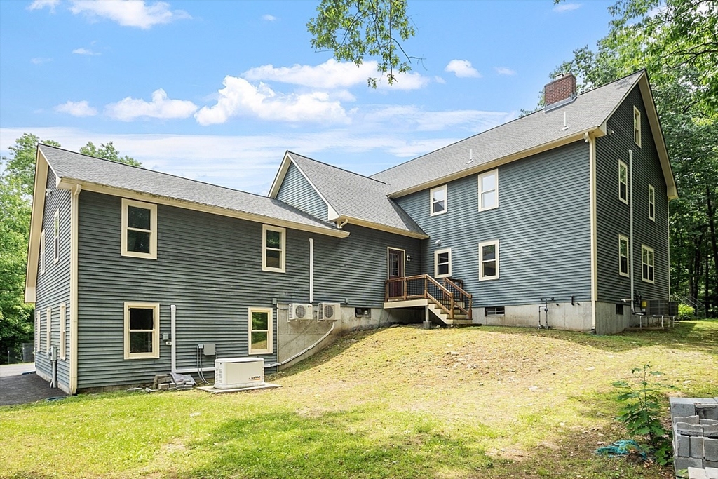 79 Tyler Road Townsend, MA 01469 - Photo 38 of 41 a backyard of a house with yard and seating area