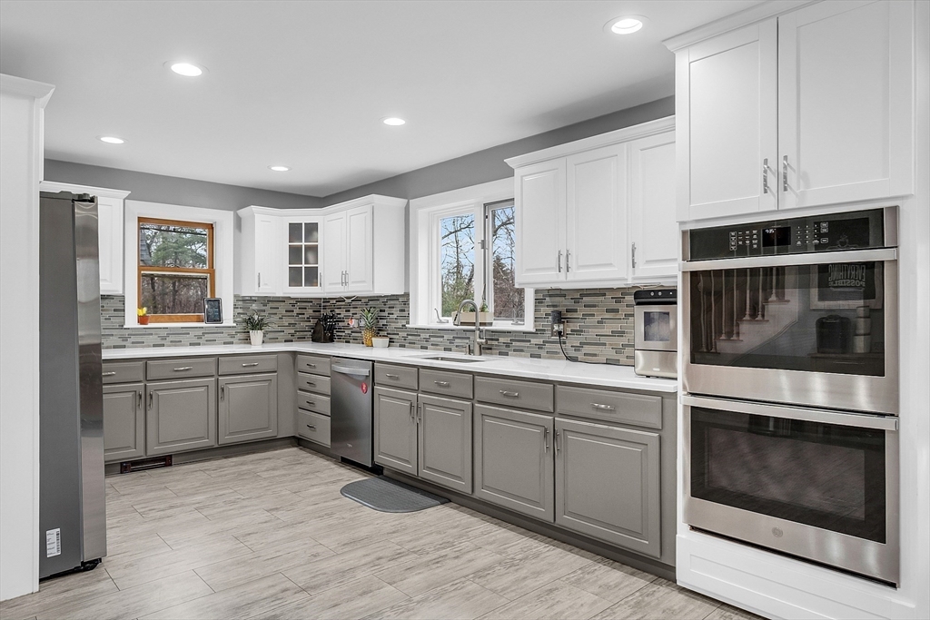 79 Tyler Road Townsend, MA 01469 - Photo 5 of 41 a kitchen with granite countertop cabinets stainless steel appliances and a sink