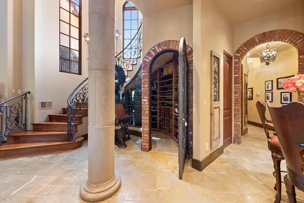 a kitchen with stainless steel appliances kitchen island granite countertop a refrigerator and a sink