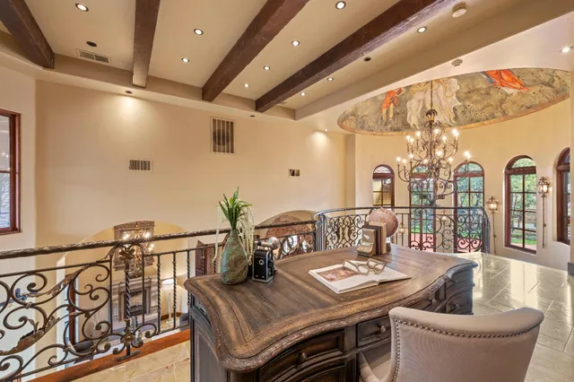 a view of a garden with flowers and trees