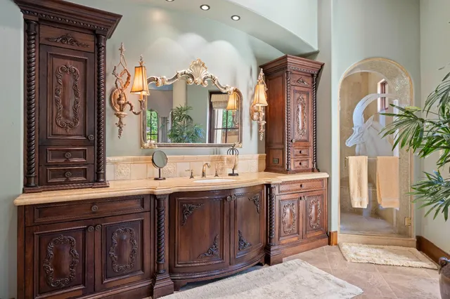 a kitchen with stainless steel appliances granite countertop a sink and a counter