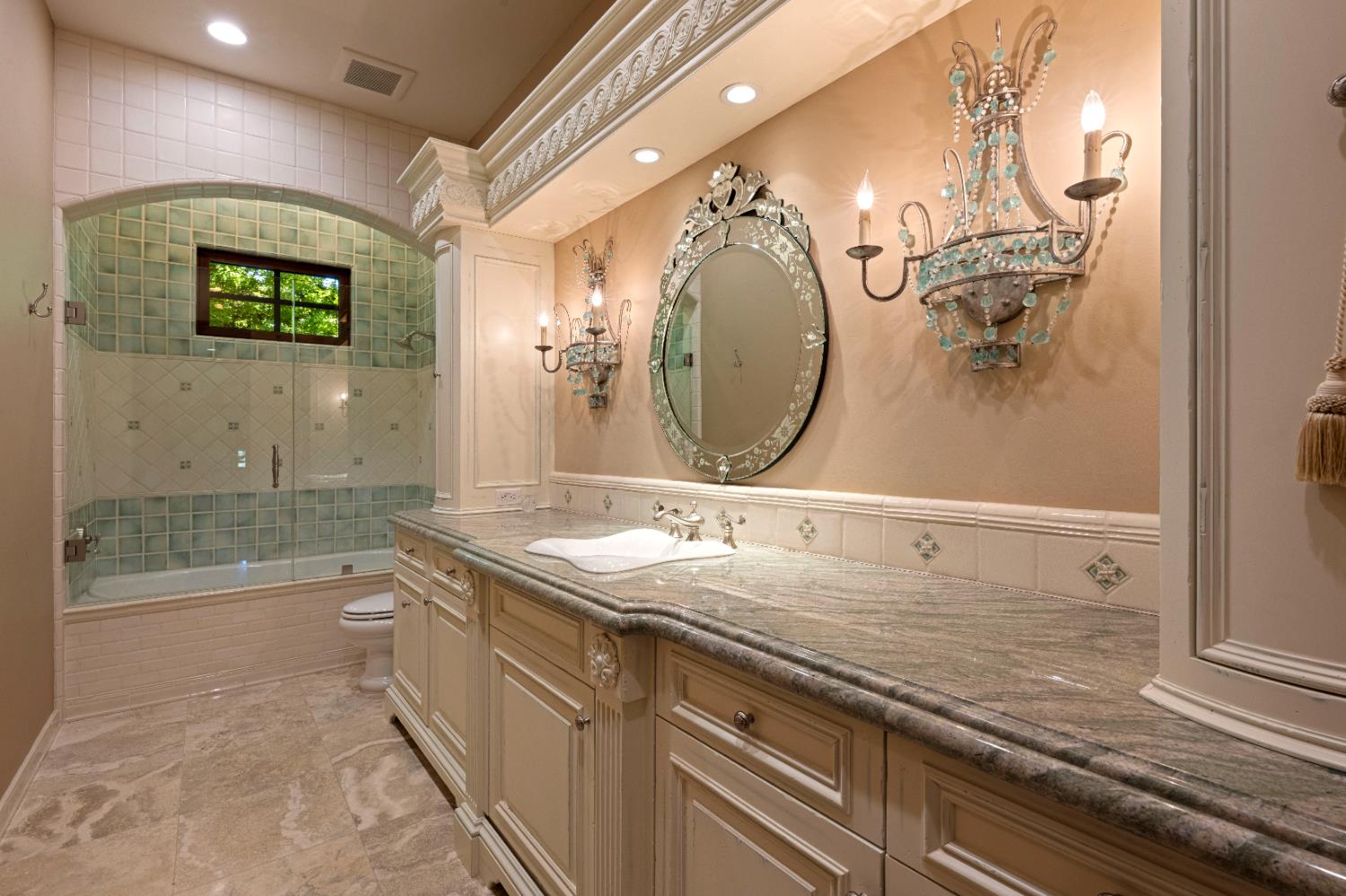 9345 King Road Loomis, CA 95650 - Photo 45 of 99 a bathroom with a granite countertop sink a mirror and shower