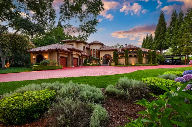 a view of a multi story building with a yard