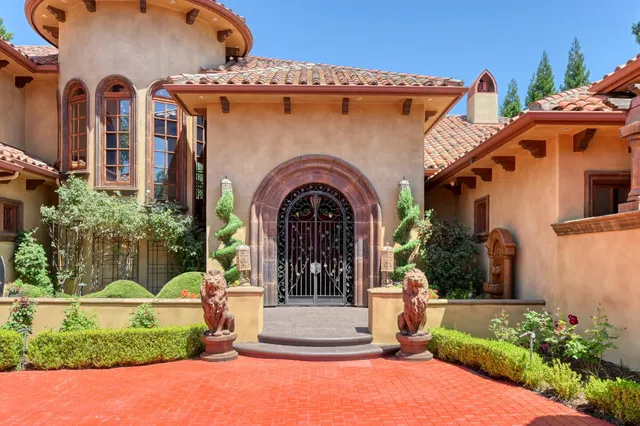 a dining room with furniture and a chandelier