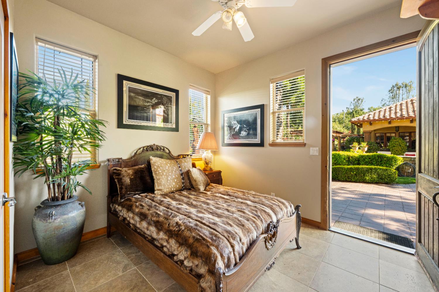 9345 King Road Loomis, CA 95650 - Photo 81 of 99 a bedroom with a balcony a bed and a couch