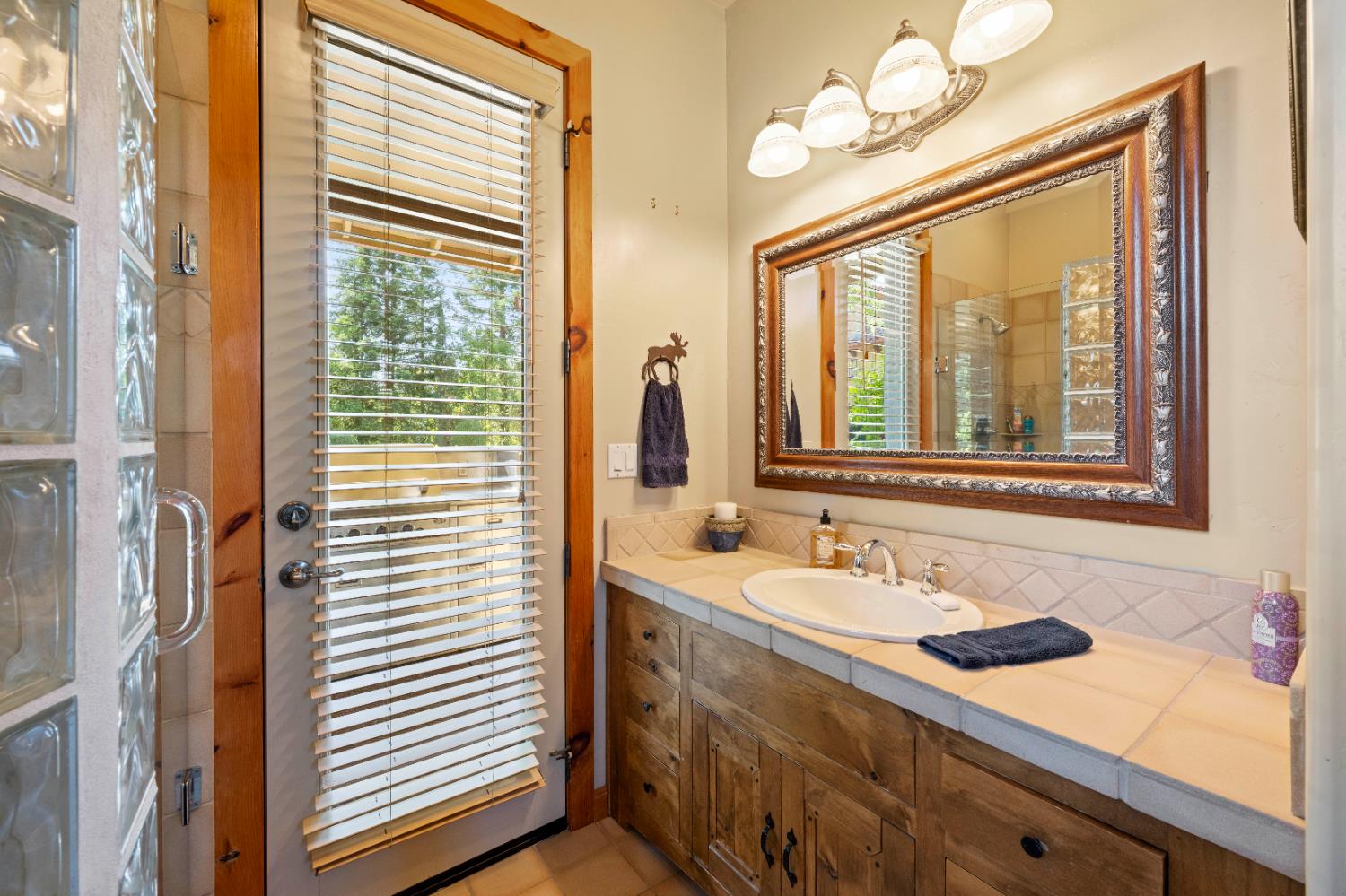 9345 King Road Loomis, CA 95650 - Photo 82 of 99 a bathroom with a sink and a mirror