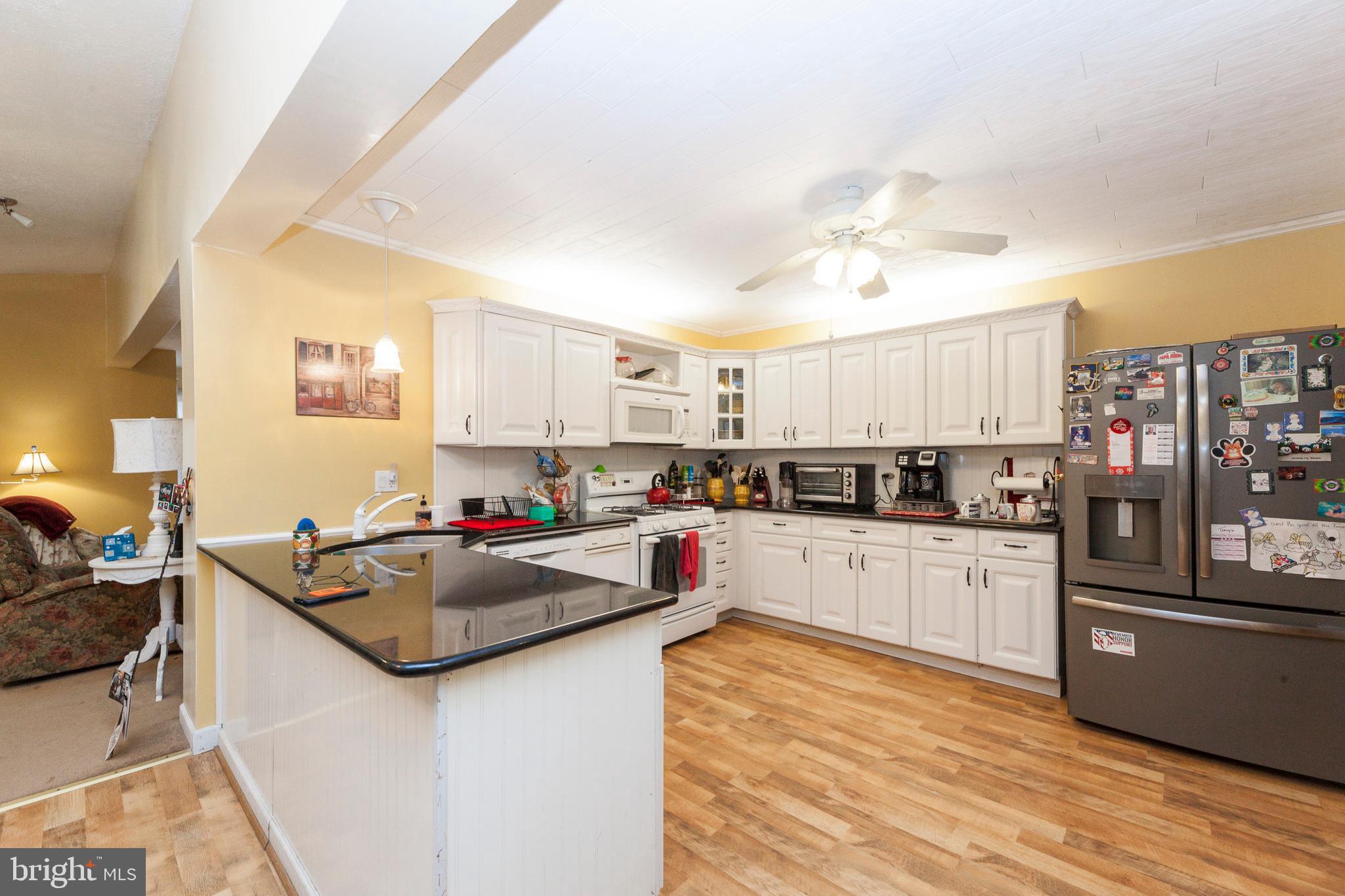 16000 Stone Foot Road Accokeek, MD 20607 - Photo 2 of 45 a kitchen with counter top space cabinets and stainless steel appliances