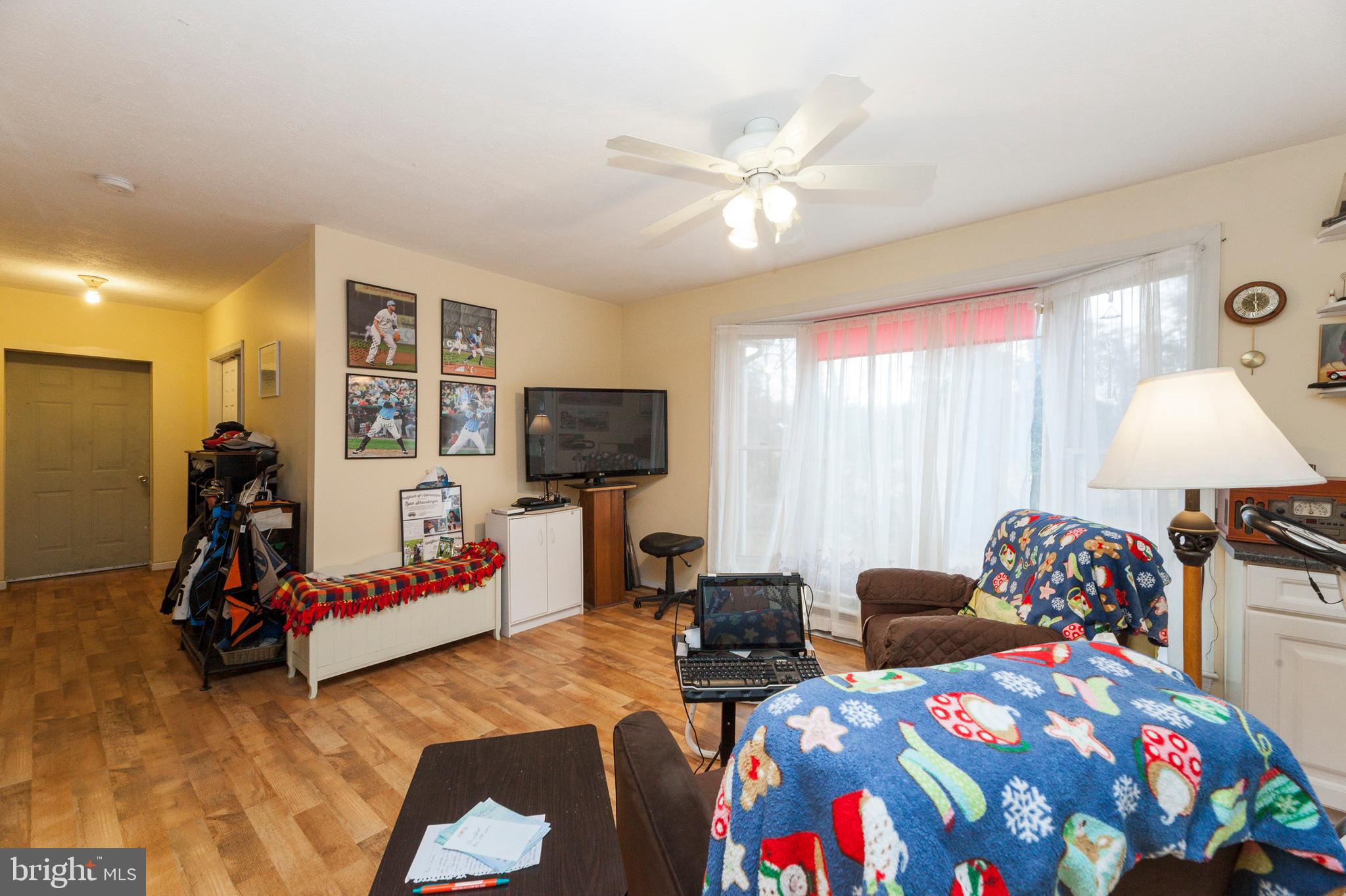 16000 Stone Foot Road Accokeek, MD 20607 - Photo 19 of 45 a bedroom with furniture and a flat screen tv