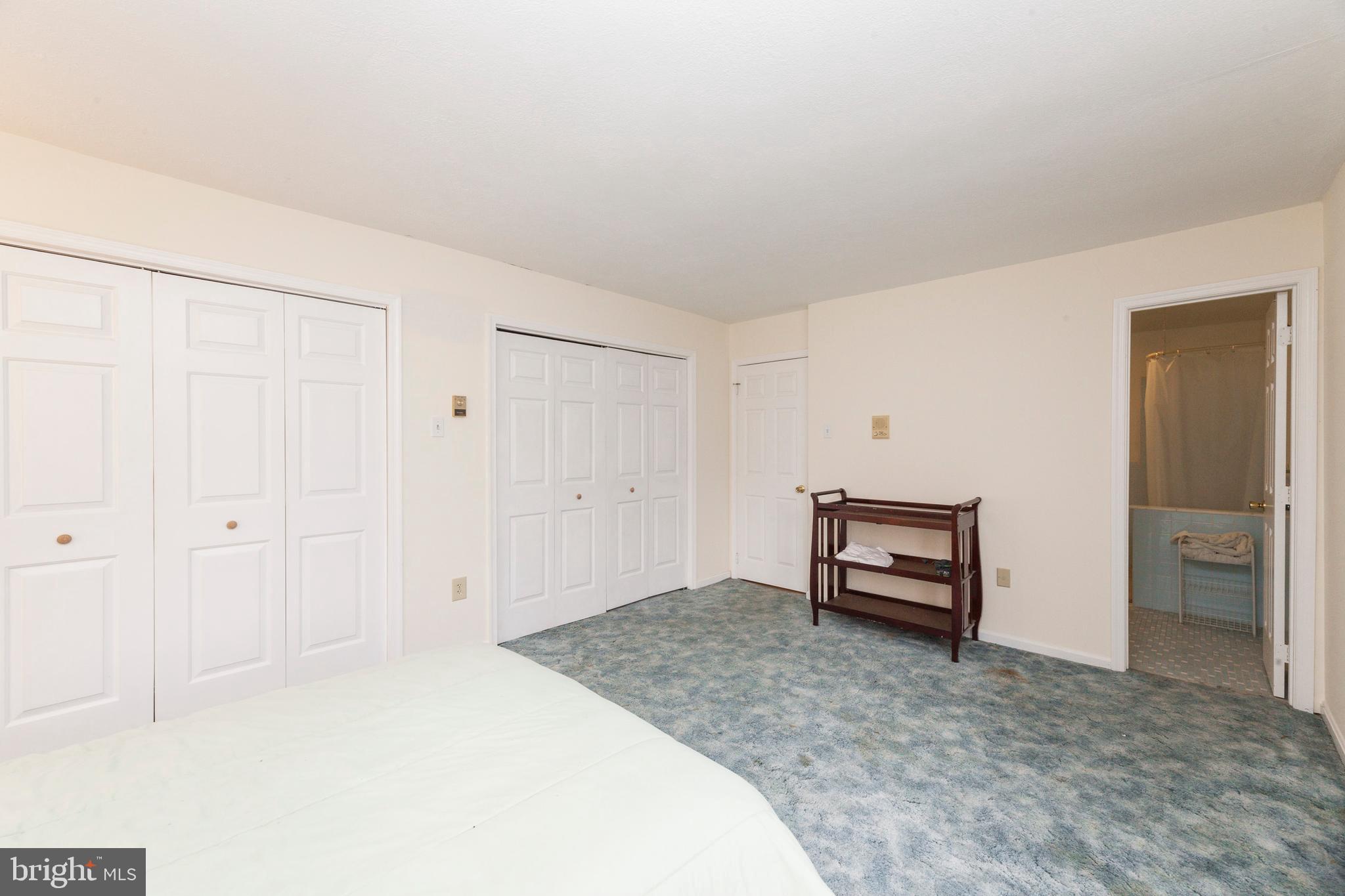 16000 Stone Foot Road Accokeek, MD 20607 - Photo 24 of 45 a bedroom with a bed and cabinets