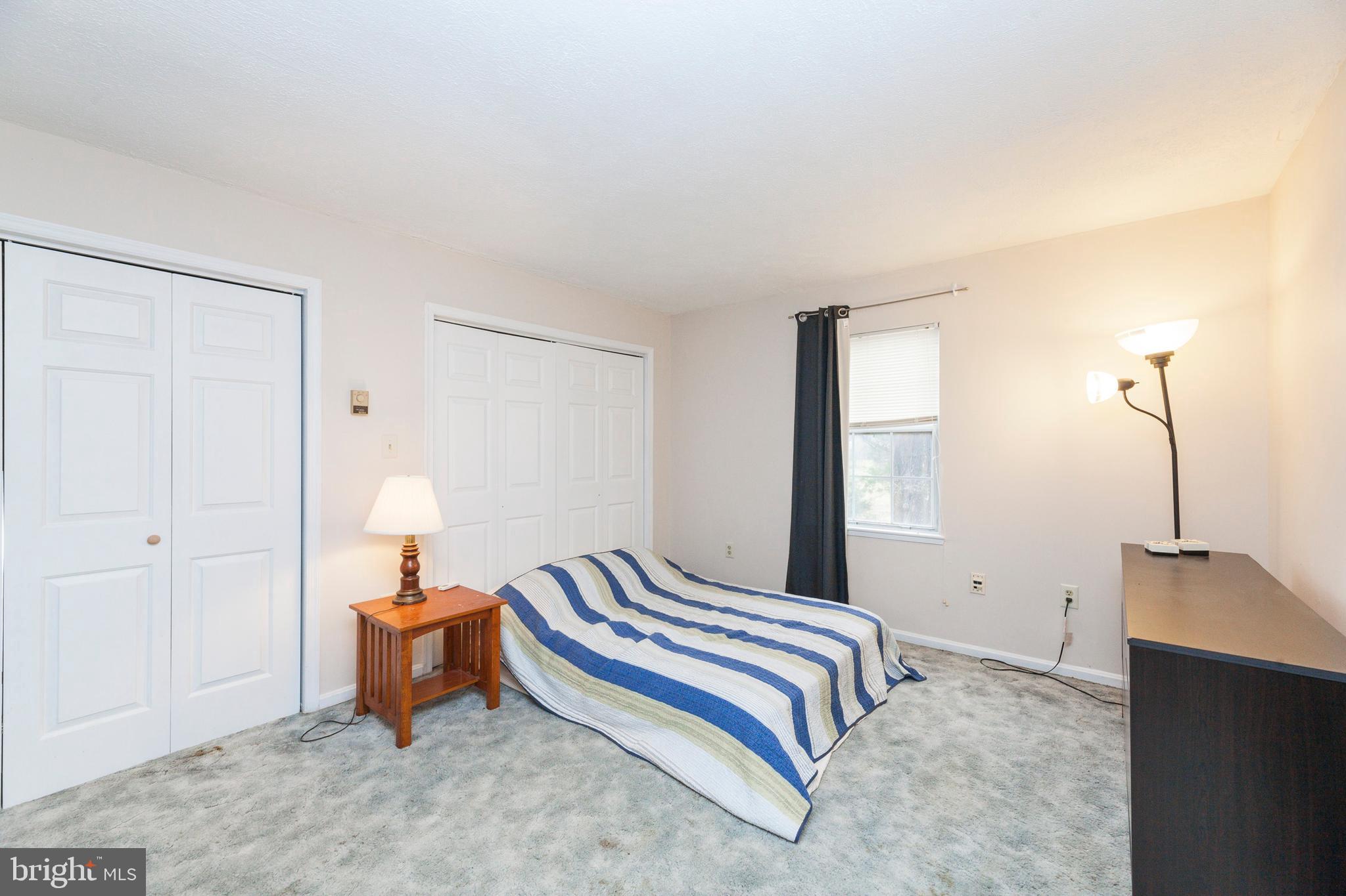 16000 Stone Foot Road Accokeek, MD 20607 - Photo 26 of 45 a bedroom with a bed and a table