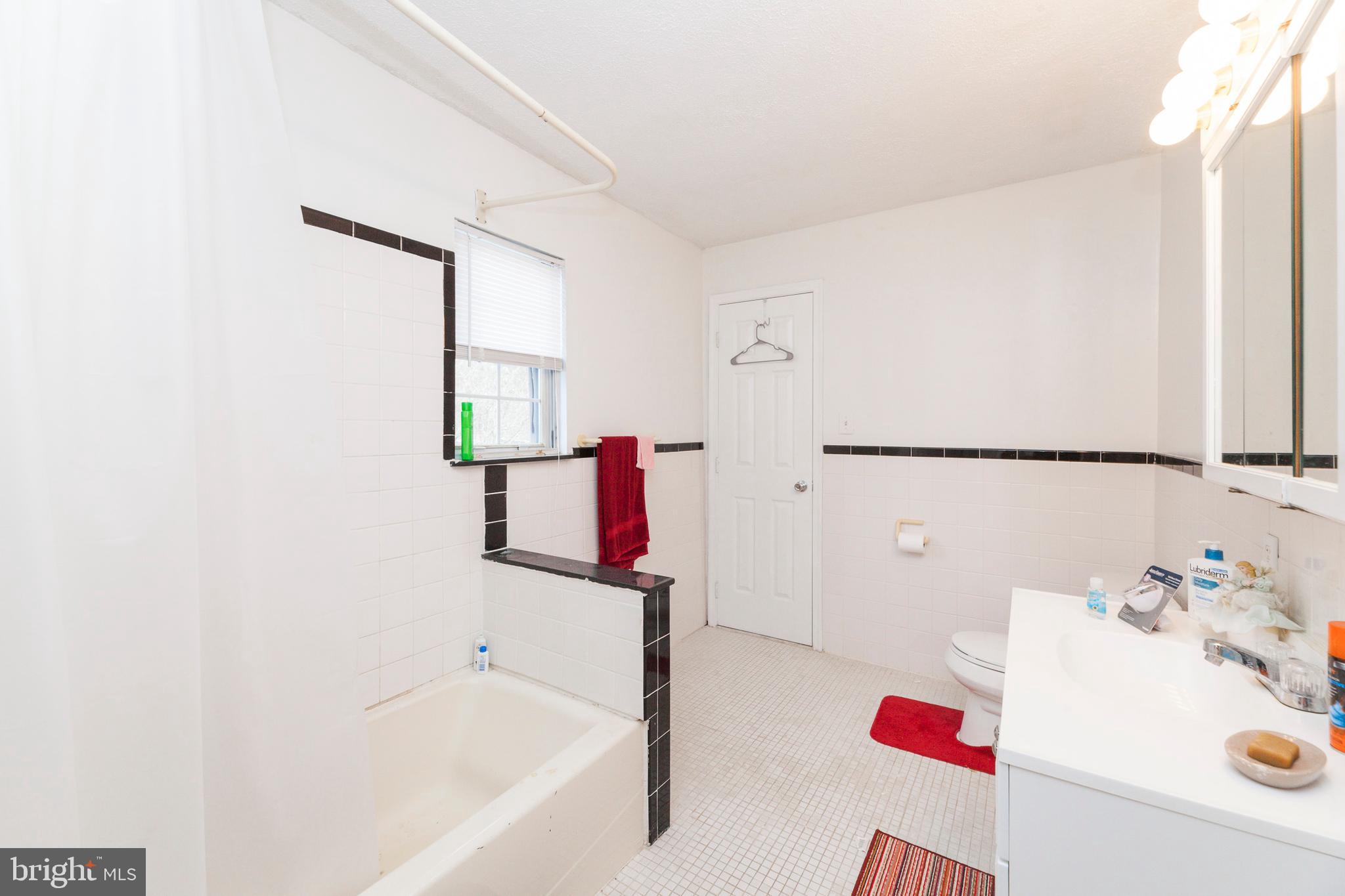 16000 Stone Foot Road Accokeek, MD 20607 - Photo 28 of 45 a bathroom with a bathtub and a shower