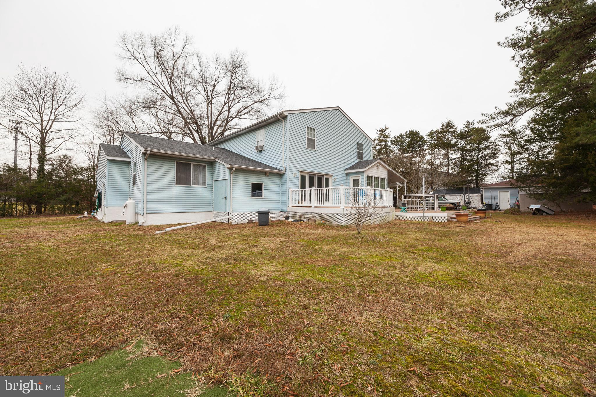 16000 Stone Foot Road Accokeek, MD 20607 - Photo 32 of 45 a front view of a house with a yard and garage