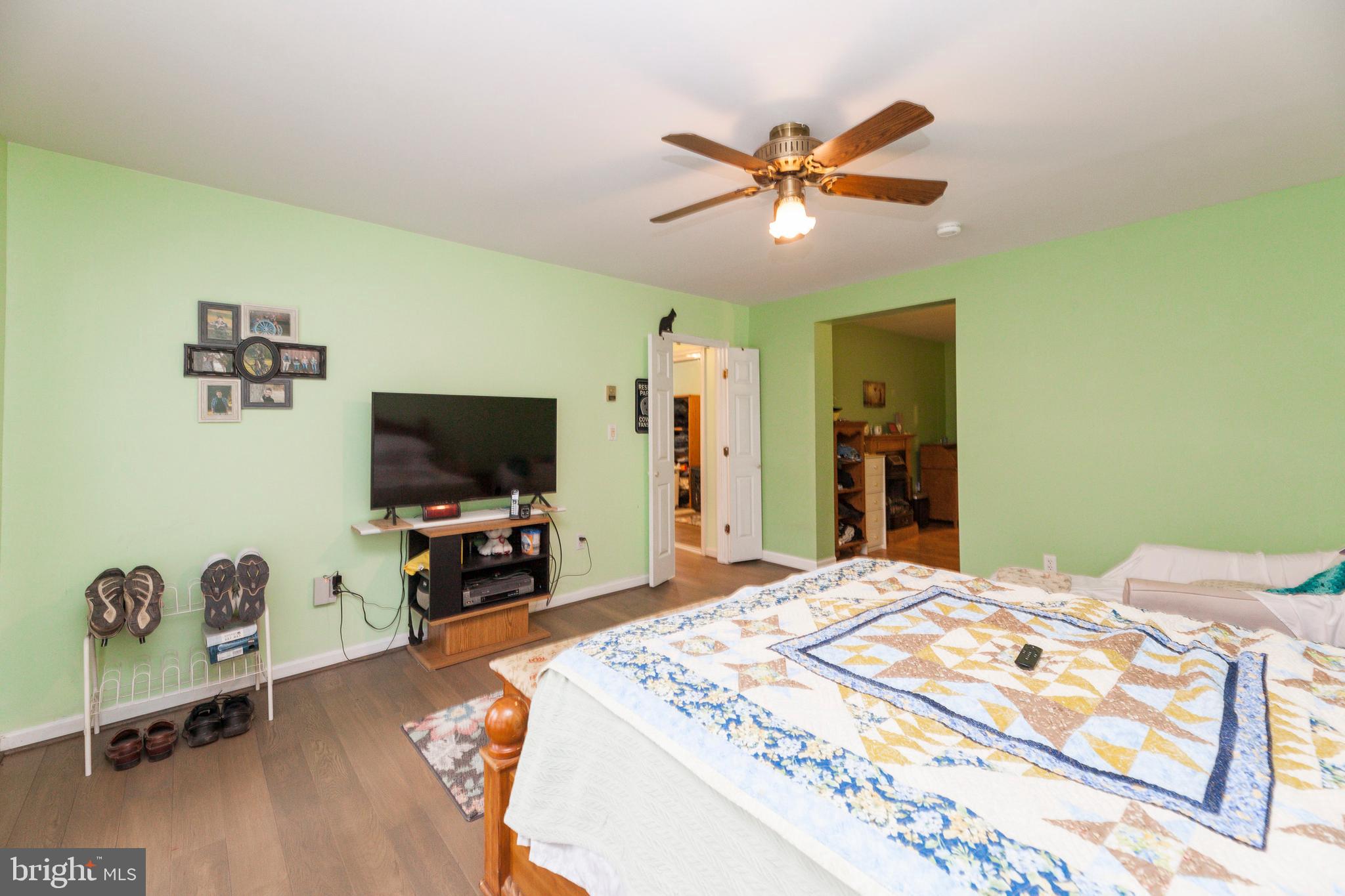 16000 Stone Foot Road Accokeek, MD 20607 - Photo 5 of 45 a bedroom with a bed and a flat screen tv