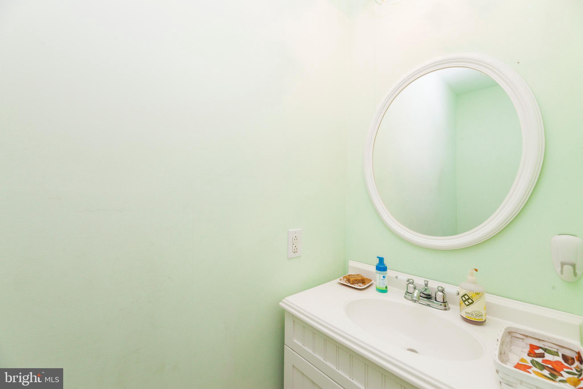 16000 Stone Foot Road Accokeek, MD 20607 - Photo 42 of 45 a bathroom with a sink and a mirror