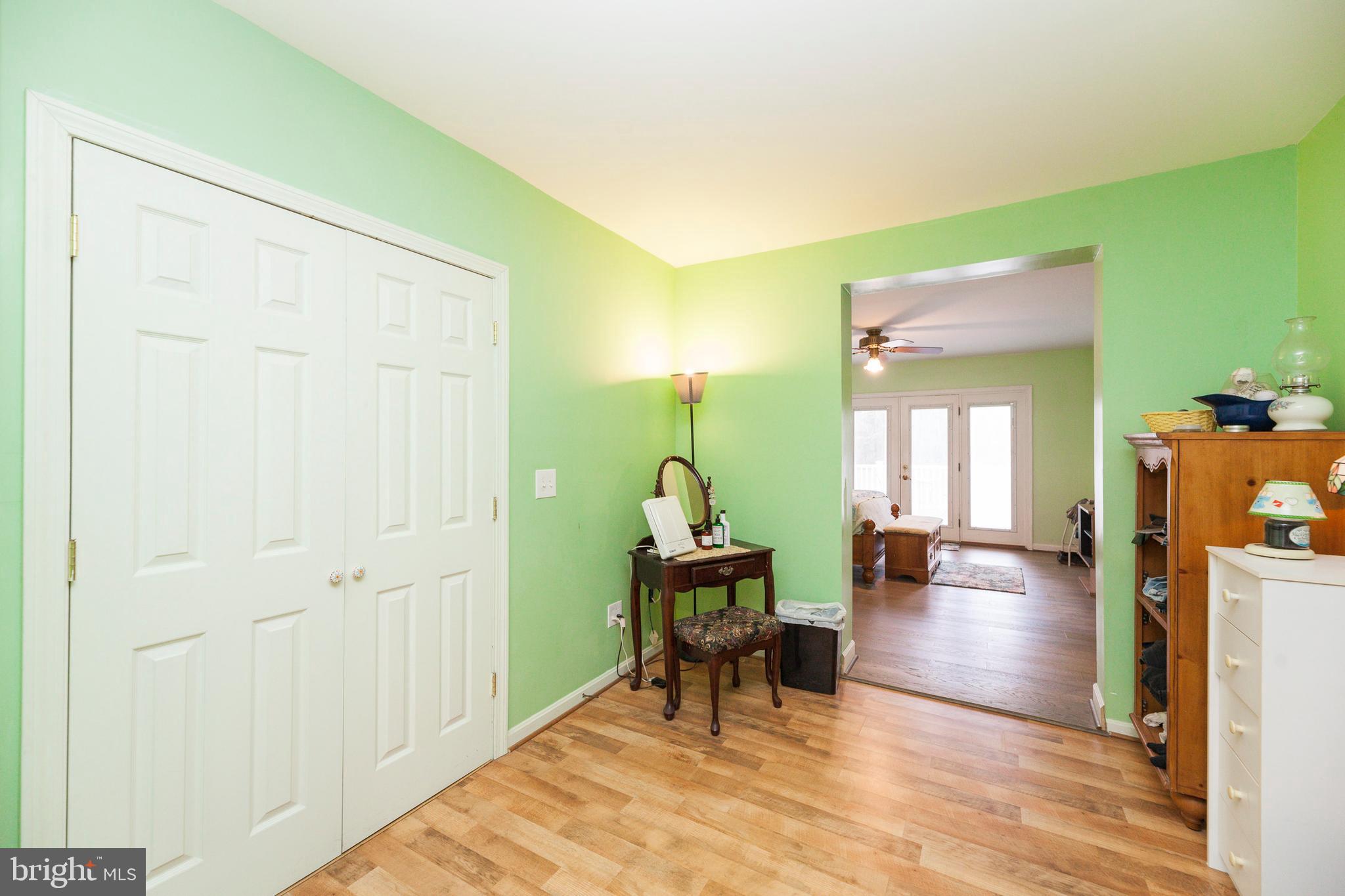 16000 Stone Foot Road Accokeek, MD 20607 - Photo 7 of 45 a living room with furniture a table and wooden floor