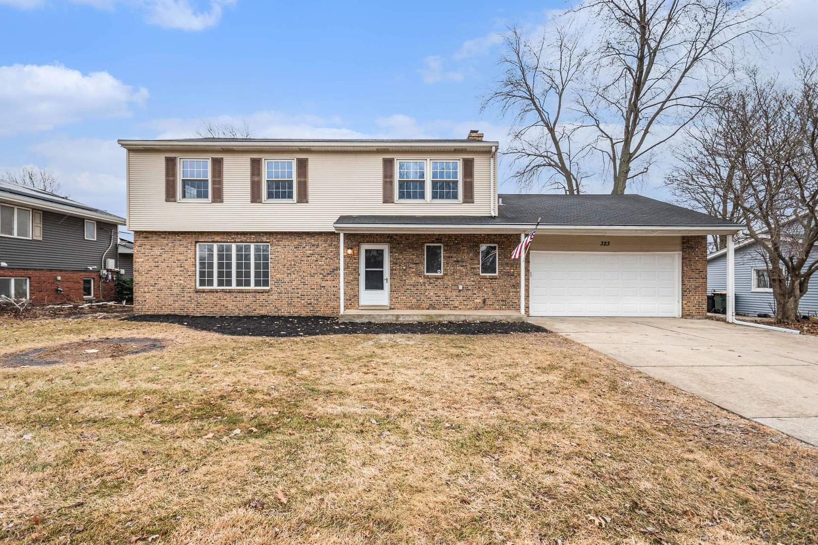 323 Chicago Road Oswego, IL 60543 - Photo 1 of 27 front view of a house with a yard