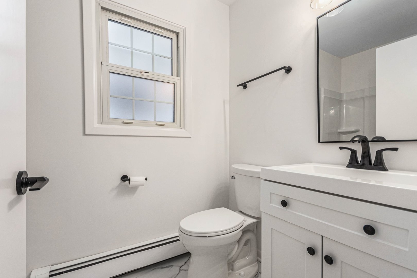 323 Chicago Road Oswego, IL 60543 - Photo 14 of 27 a bathroom with a sink a toilet and shower