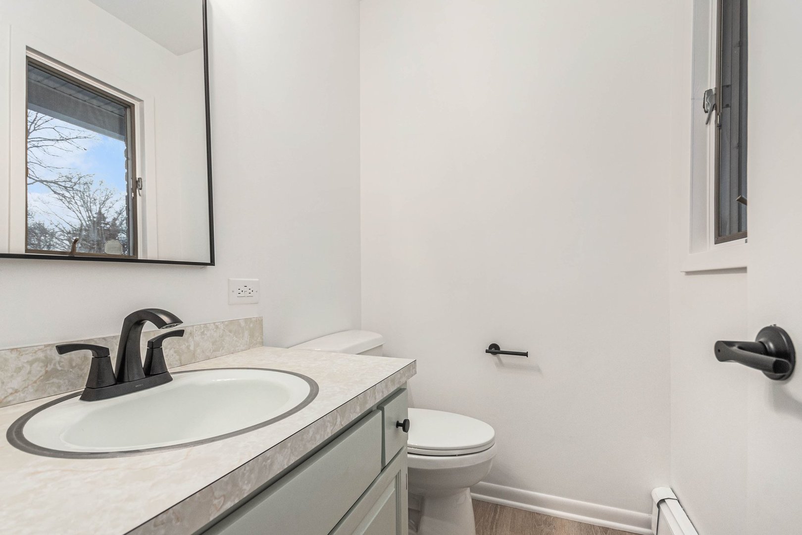 323 Chicago Road Oswego, IL 60543 - Photo 19 of 27 a bathroom with a toilet sink and mirror