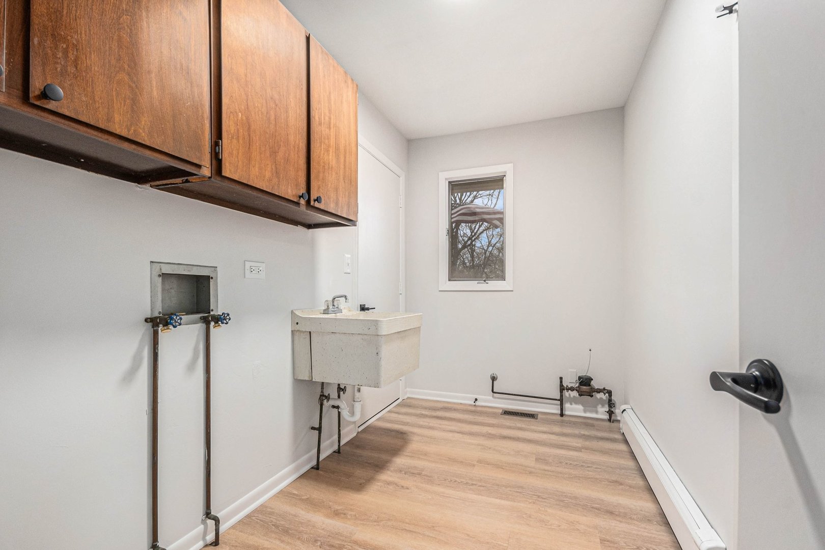 323 Chicago Road Oswego, IL 60543 - Photo 20 of 27 a view of a room with wooden floor and cabinet