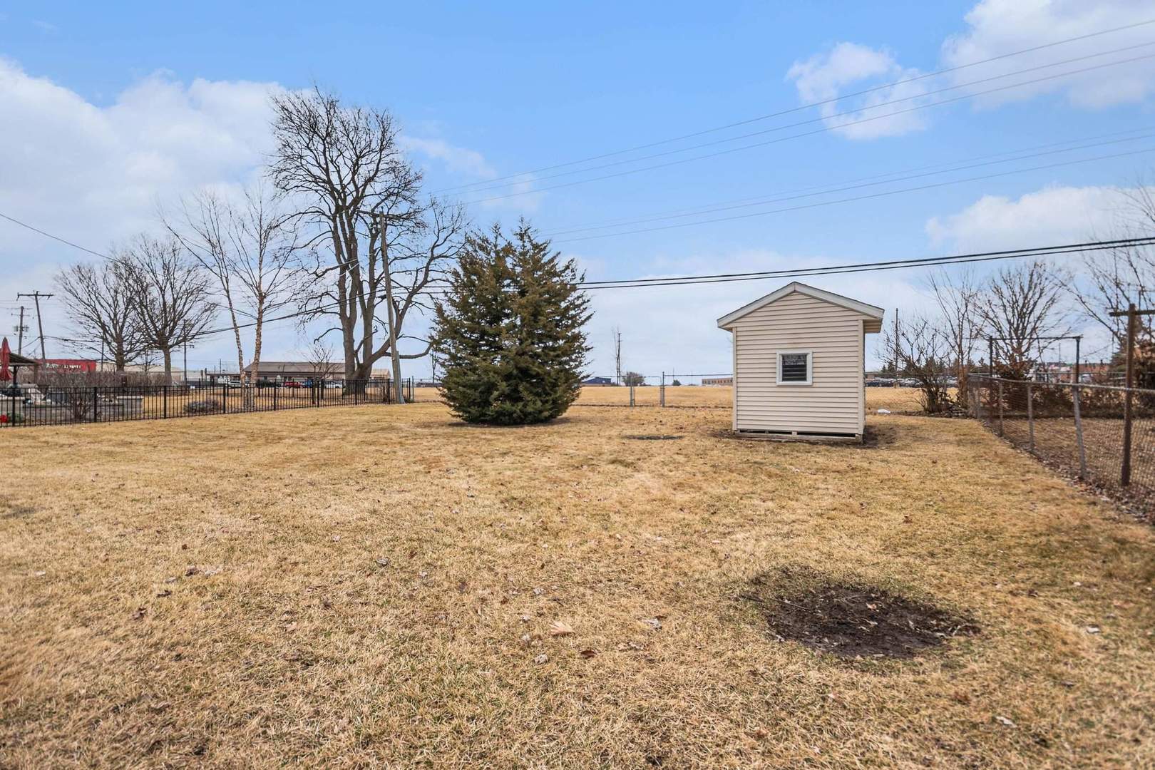 323 Chicago Road Oswego, IL 60543 - Photo 22 of 27 a view of large house with a yard