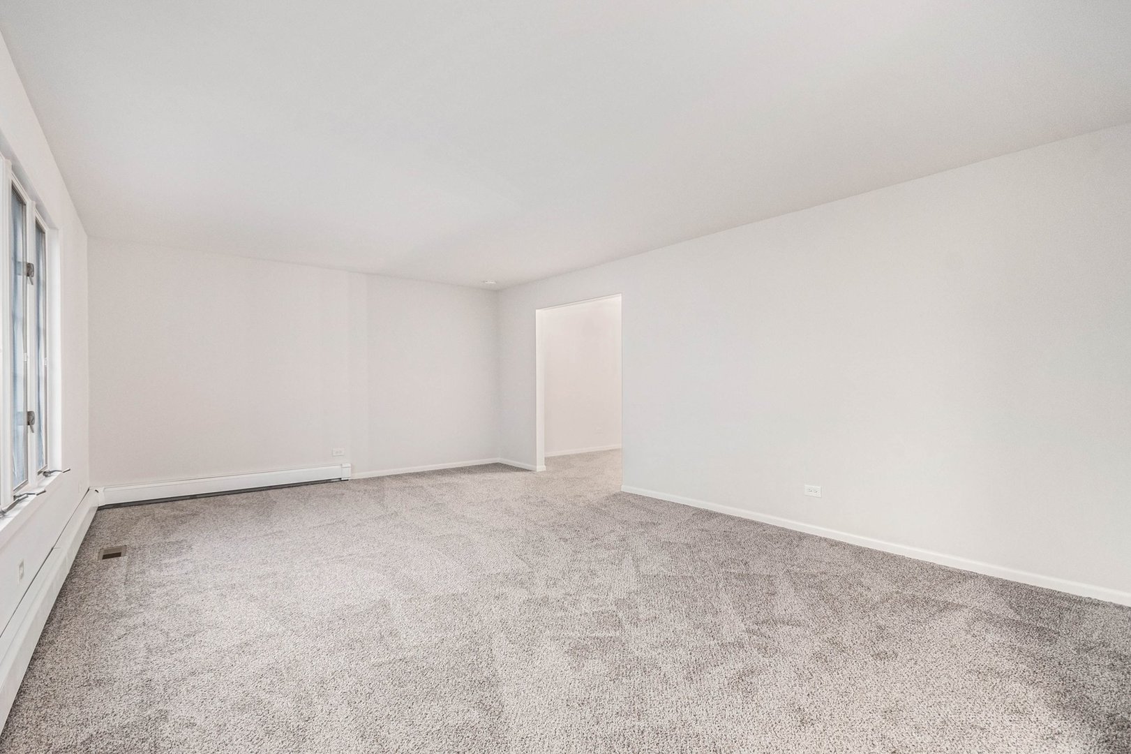 323 Chicago Road Oswego, IL 60543 - Photo 3 of 27 a view of an empty room and a window