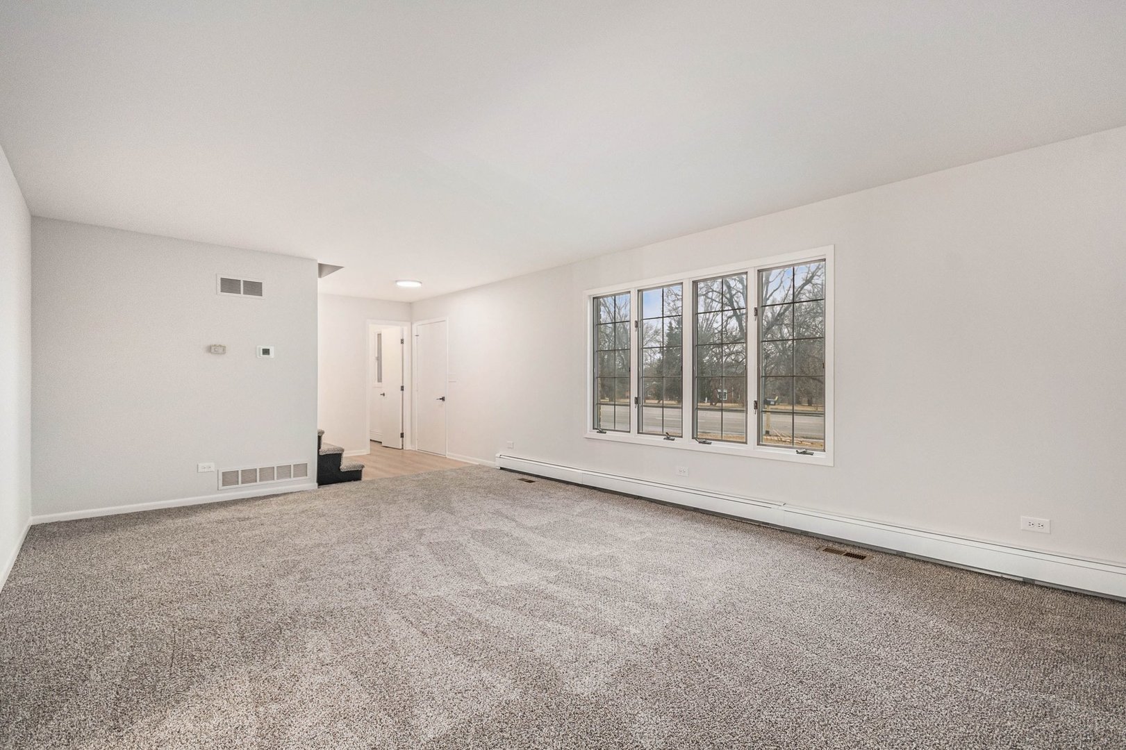 323 Chicago Road Oswego, IL 60543 - Photo 4 of 27 an empty room with a window