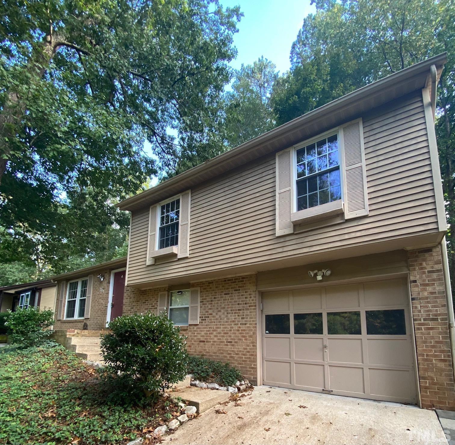 7317 Shellburne Drive Raleigh, NC 27612 - Photo 2 of 28 a house that has a tree in front of the house