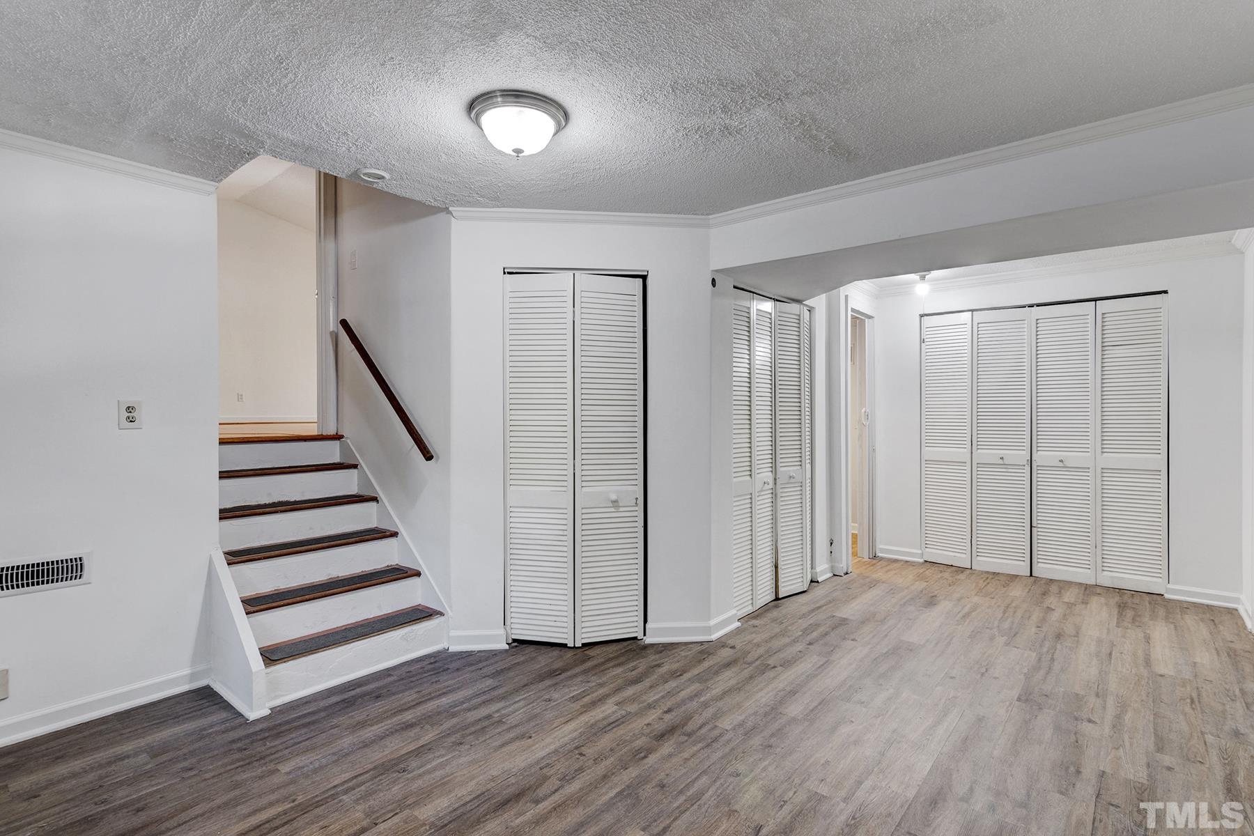 7317 Shellburne Drive Raleigh, NC 27612 - Photo 20 of 28 an empty room with wooden floor & entryway