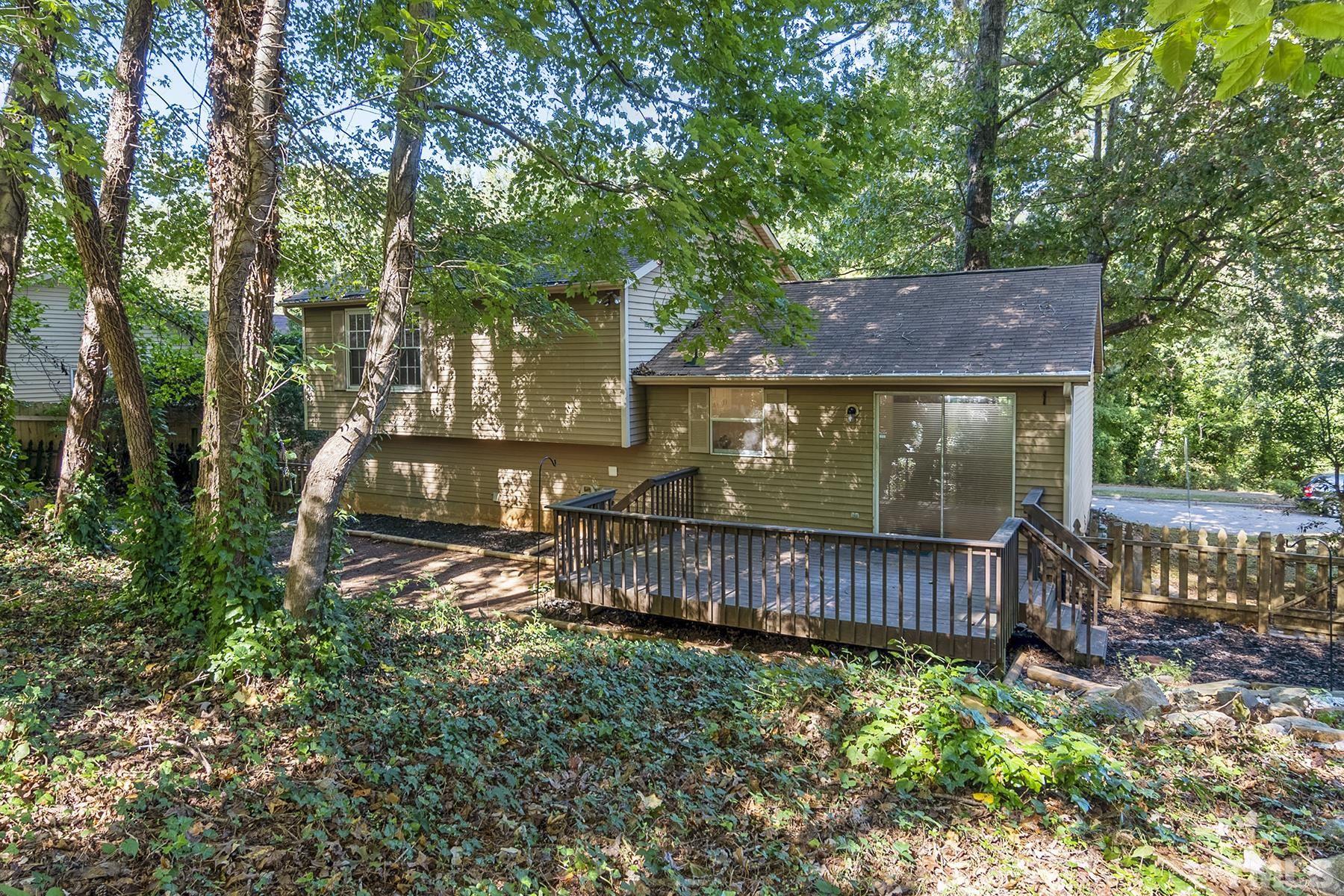 7317 Shellburne Drive Raleigh, NC 27612 - Photo 25 of 28 a view of a backyard with a swing and a swing