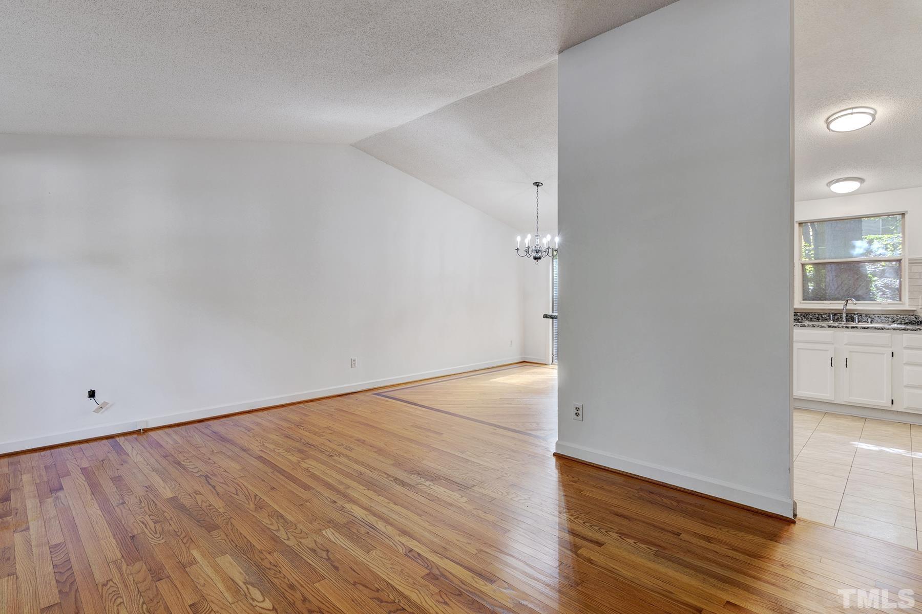 7317 Shellburne Drive Raleigh, NC 27612 - Photo 4 of 28 wooden floor in an empty room